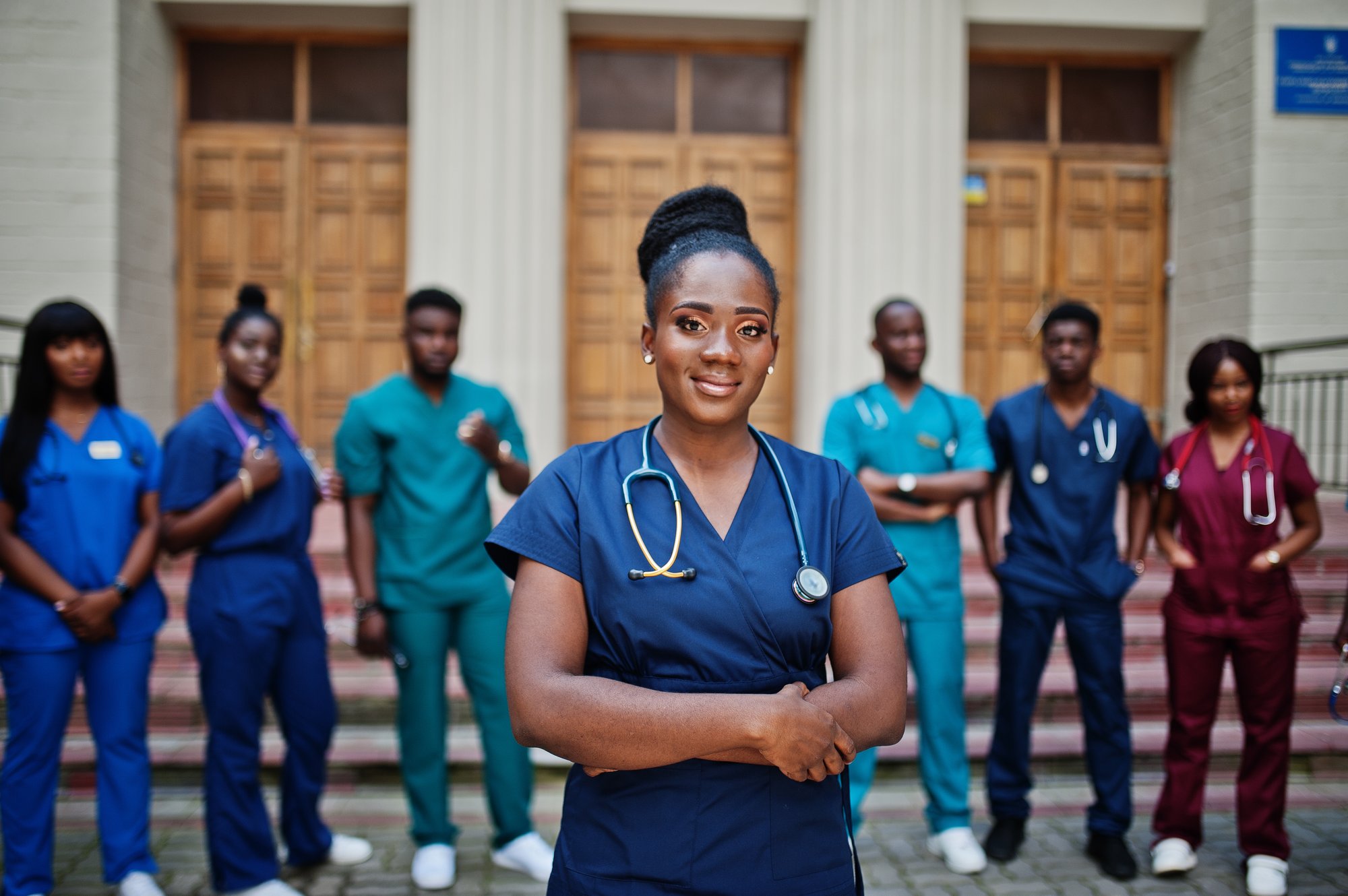 group-african-medical-students-posed-outdoor-against-university-door group-african-medical-students-posed-outdoor-against-university-door