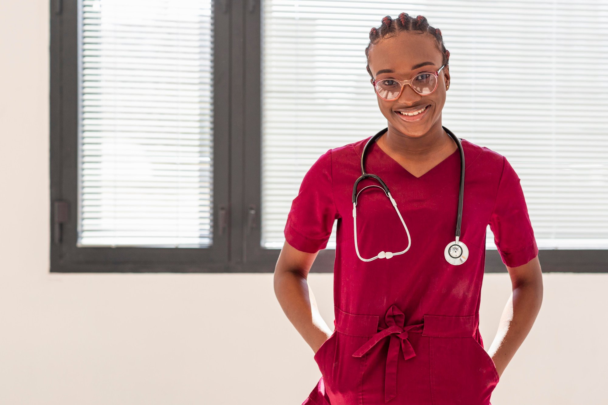 woman-medic-wearing-stethoscope-red-uniform